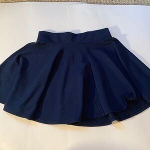 Gently used navy women’s skirt size small.